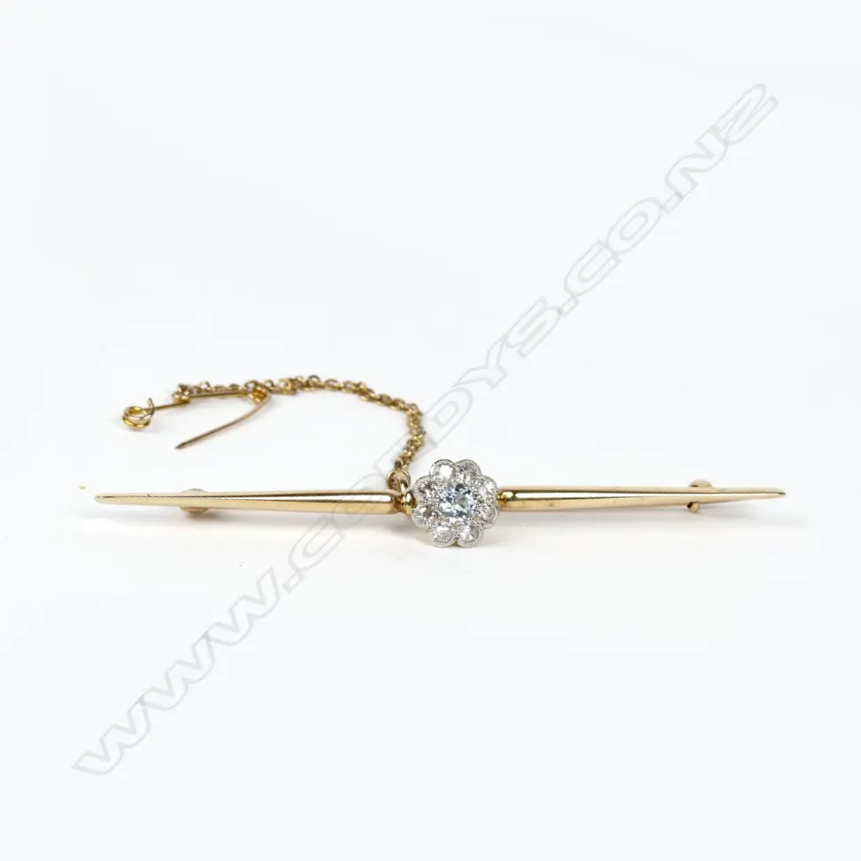 An estate 15ct. gold and diamond brooch Image 1++