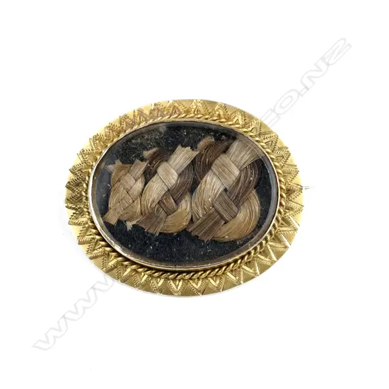 A Victorian 9ct. yellow gold memorial brooch