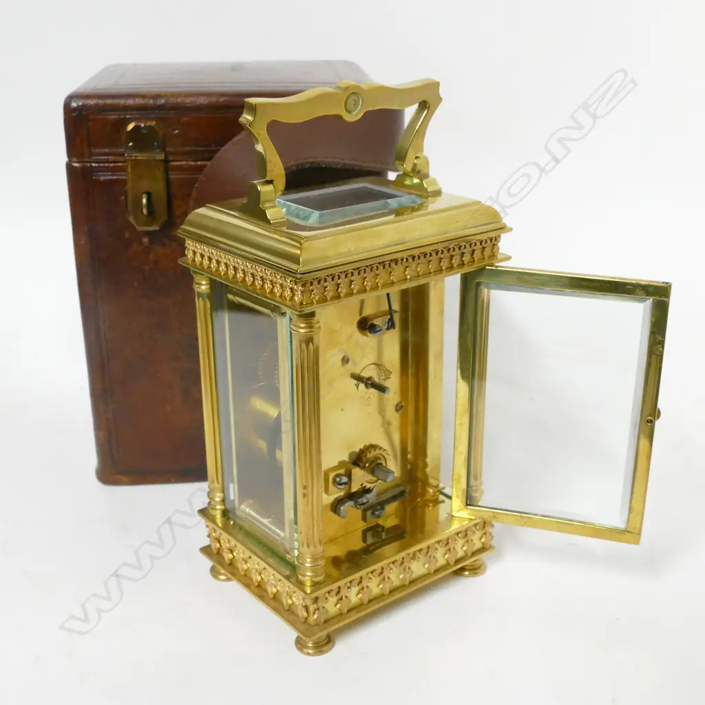 A decorative brass cased carriage clock retailed by Grant & Son Image 1++