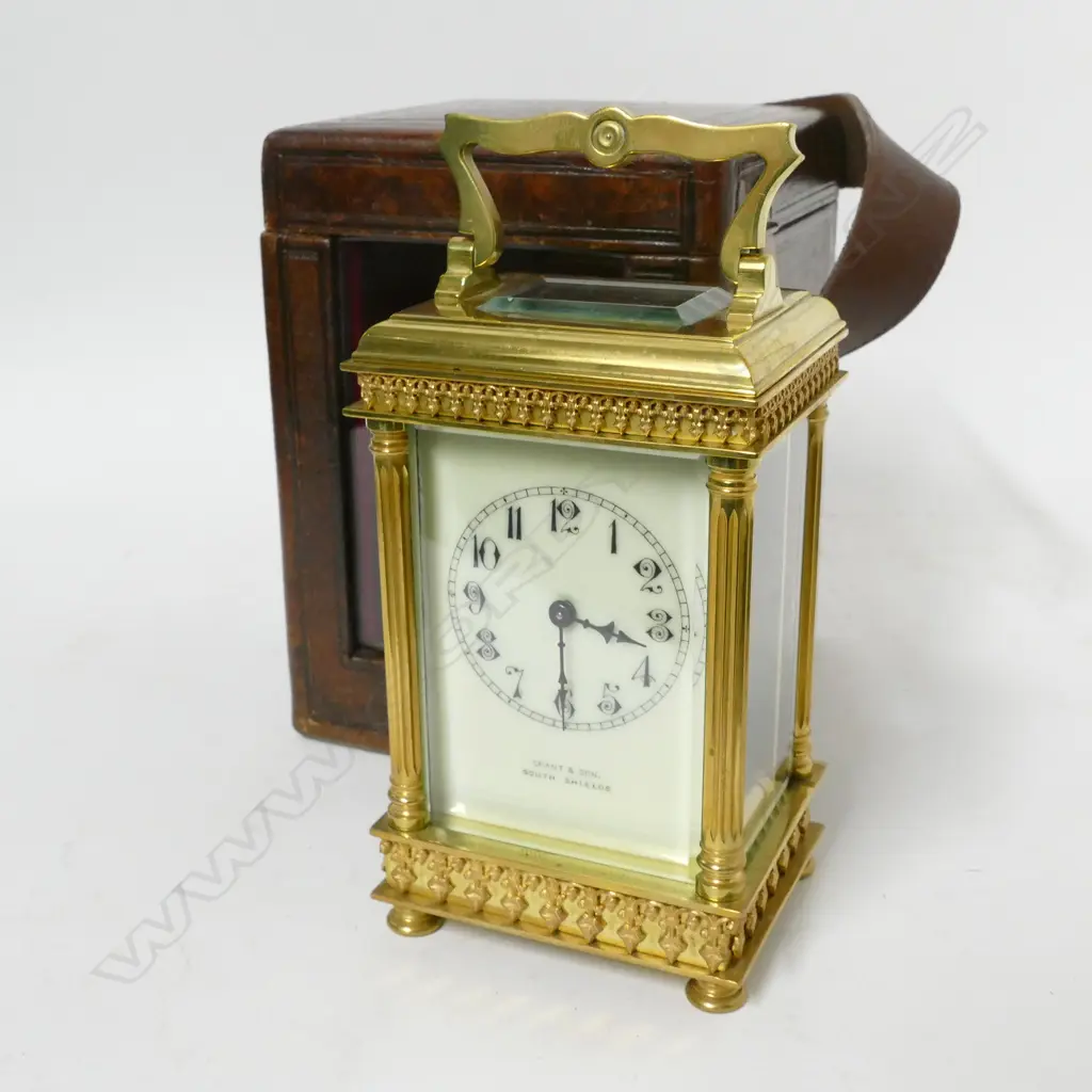 A decorative brass cased carriage clock retailed by Grant & Son Image 1++