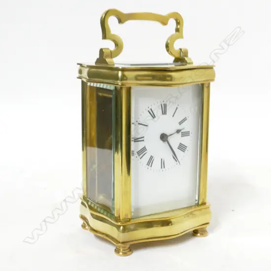 A French brass serpentine corniche cased carriage clock