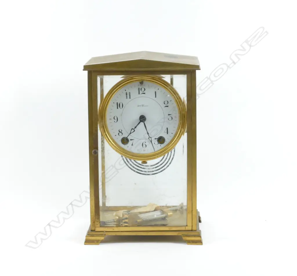 A Seth Thomas four-glass mantel clock with a white enamel dial Image 1++