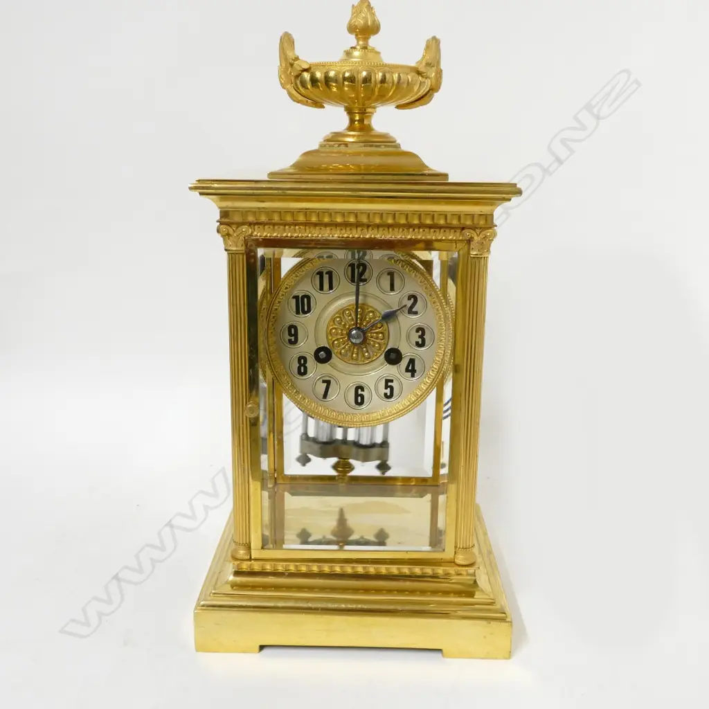 A French brass four glass two train mantel clock Image 1++