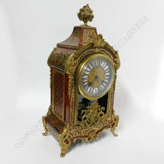 A French red tortoiseshell Boulle cased mantel clock