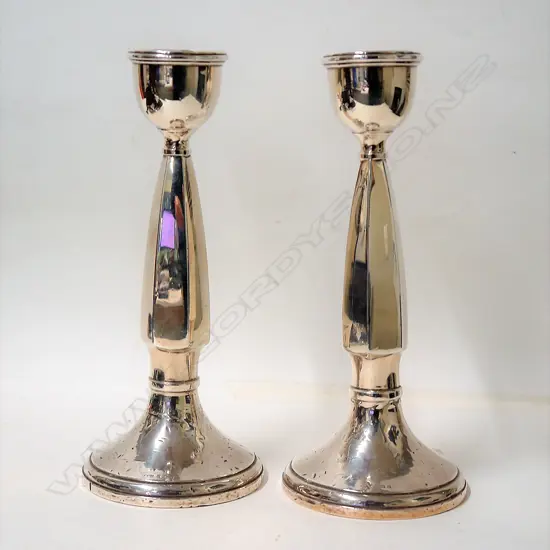 A pair of 1920s silver column candlesticks