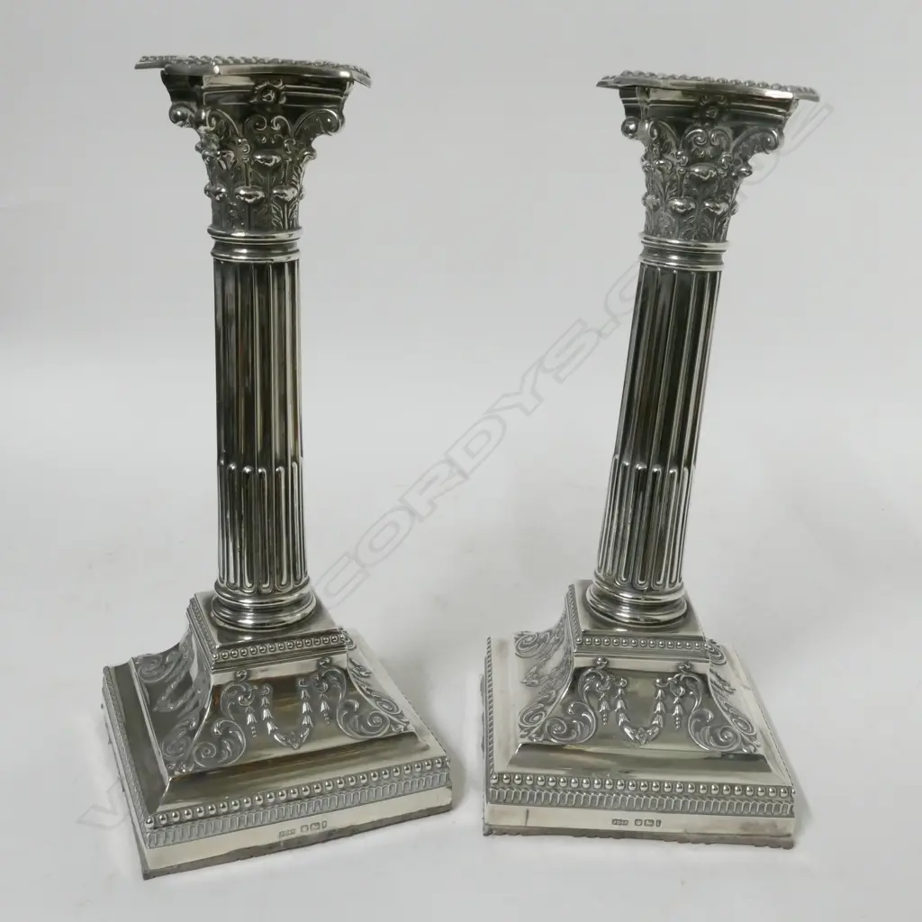 A pair of Edwardian silver Corinthian column candlesticks Image 1++