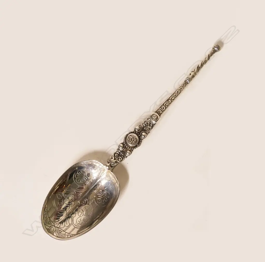 A silver anointing spoon Image 1++