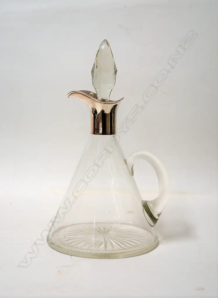 A stylish 1920s silver and glass claret jug Image 1++