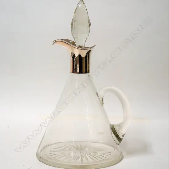 A stylish 1920s silver and glass claret jug
