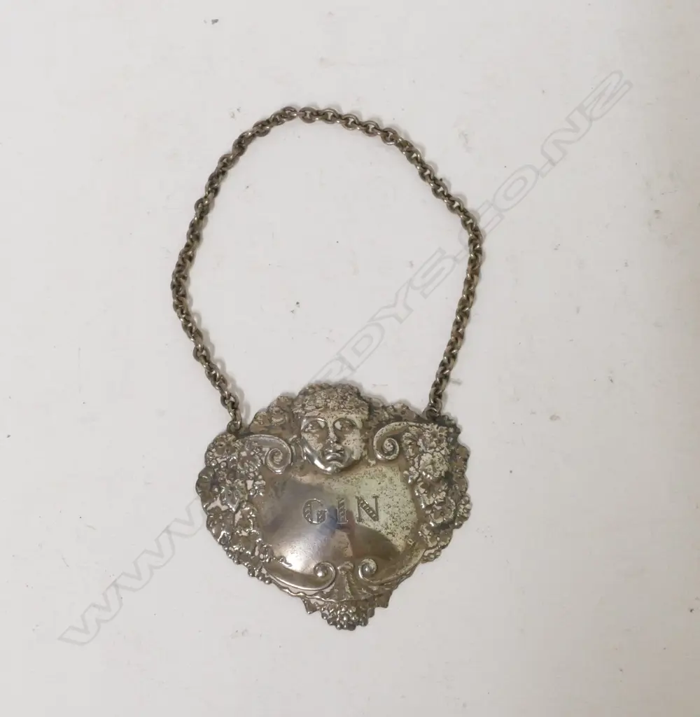 A silver 'Gin' bottle ticket Image 1++