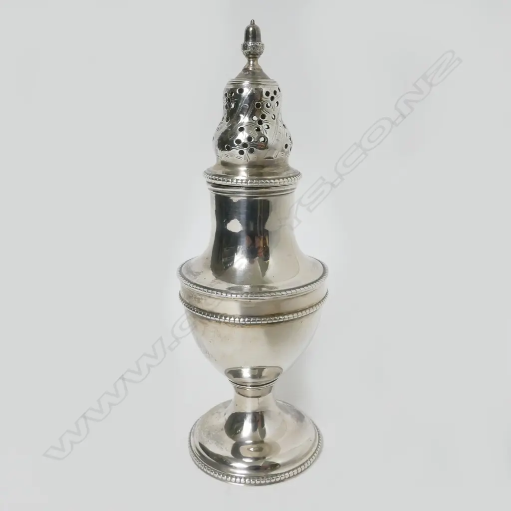 A George III silver vase shaped caster Image 1++