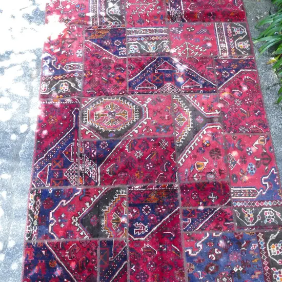 A Persian patchwork rug
