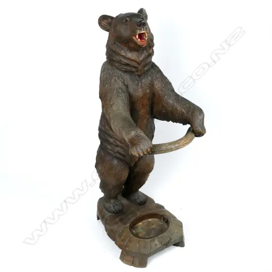 A Black Forest carved bear stick stand