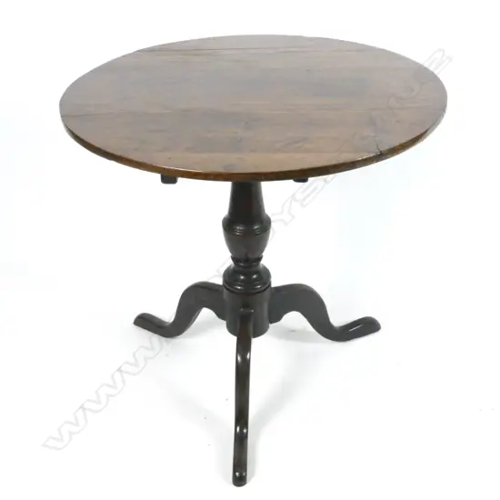 A Georgian oak circular tilt-top wine table