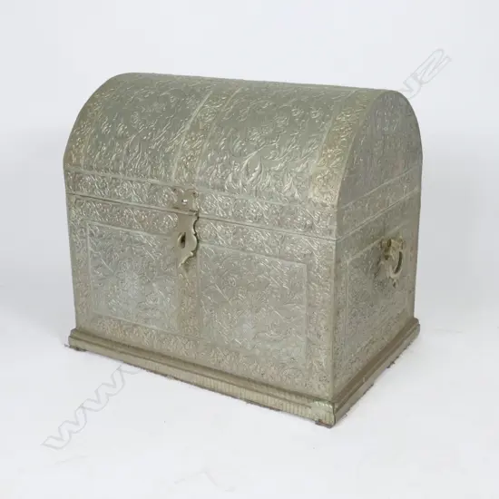 A decorative metal lined dome top casket shaped storage box