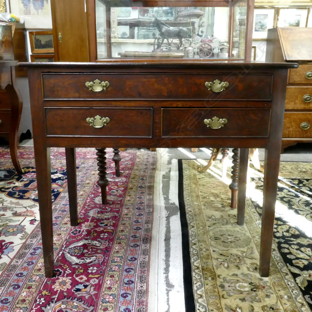 A Georgian oak country lowboy Image 1++