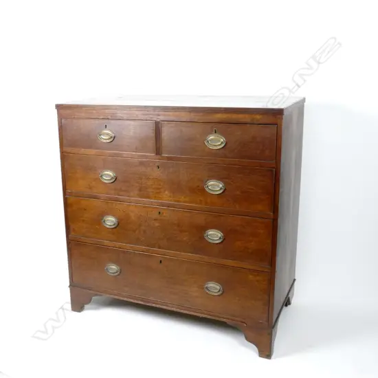 A Georgian oak flat-front chest of drawers