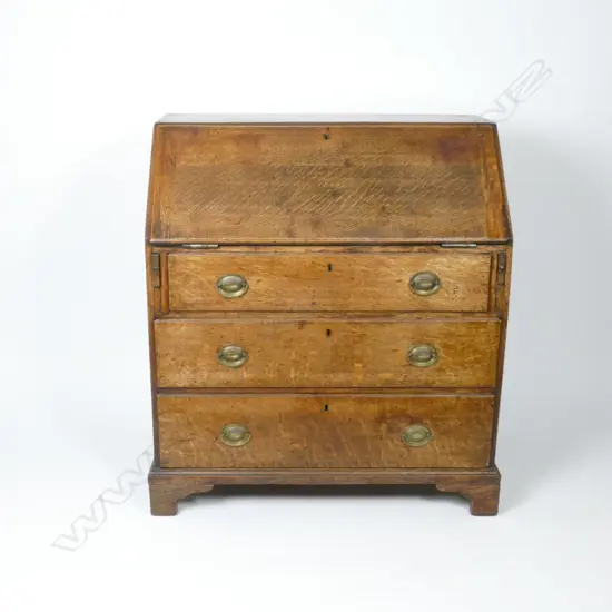 A Georgian oak drop-front bureau