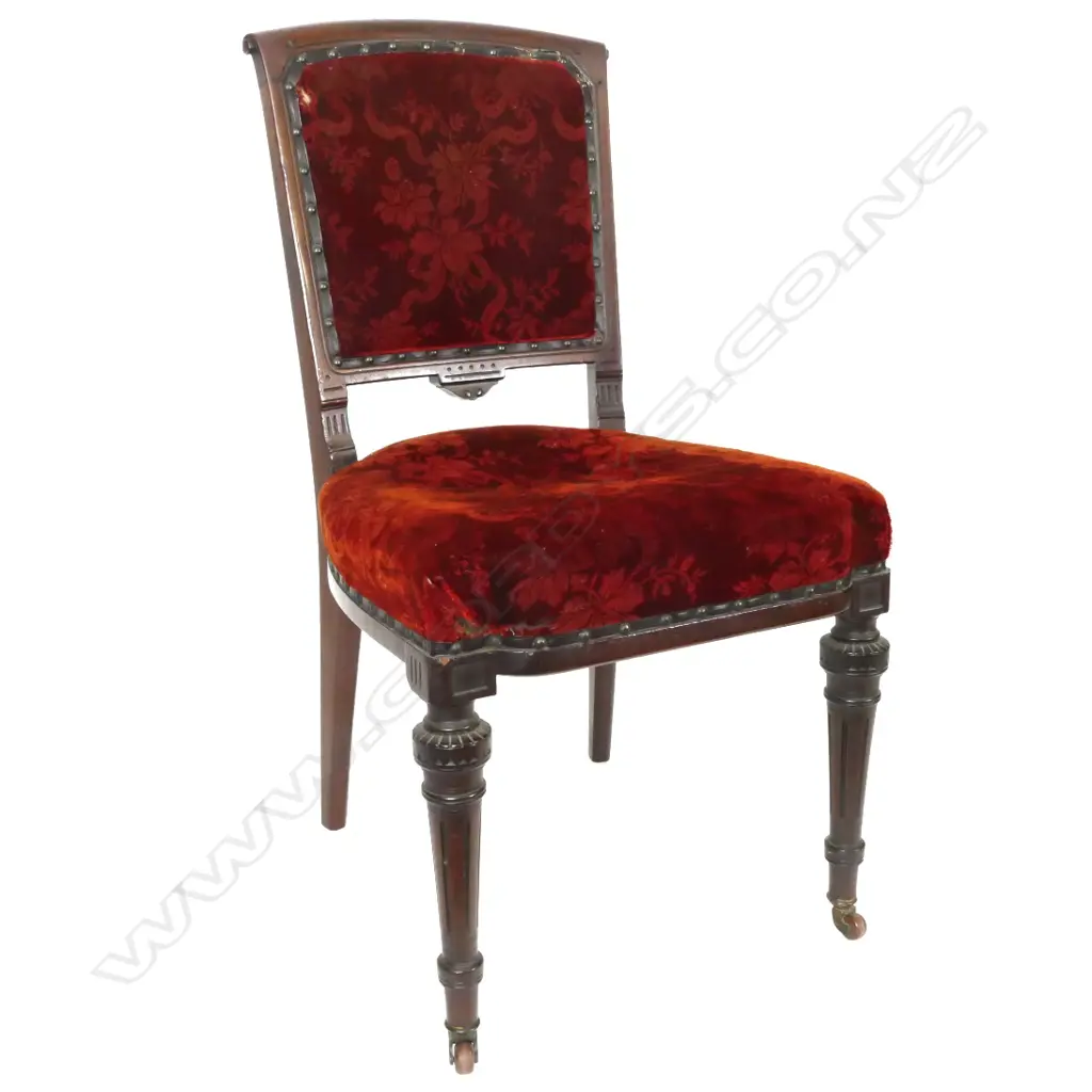 A set of four Victorian Aesthetic mahogany carved dining chairs by Lamb of Manchester Image 1++