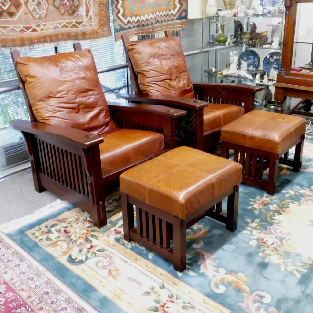 A pair of mahogany American Arts and Crafts Mission style armchairs and footstools Image 1++
