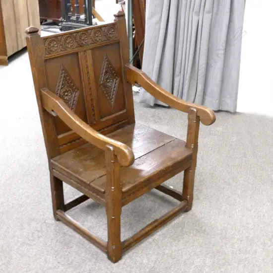 An antique oak wainscot chair