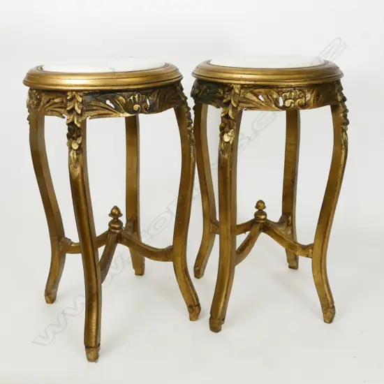 A pair of carved giltwood plant stands