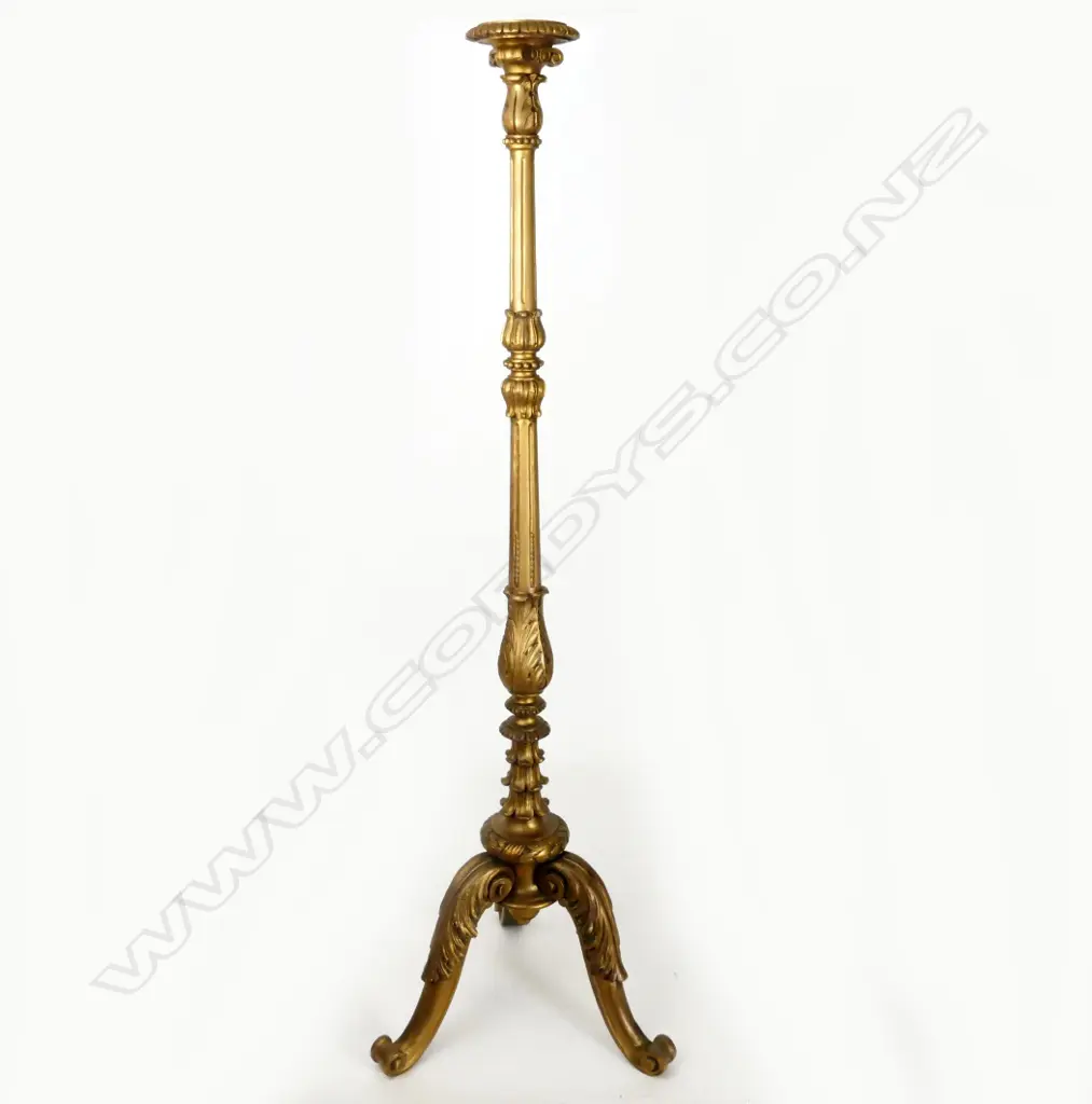 A decorative giltwood carved torchiere Image 1++