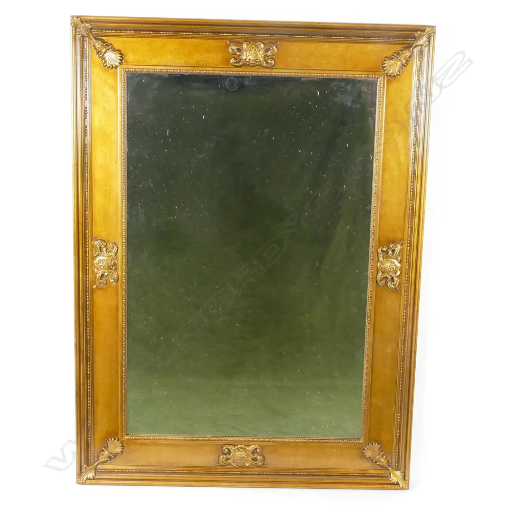 A gilt framed mirror Image 1++