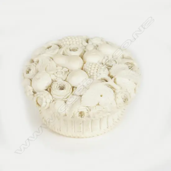 A small carved ivory lidded basket