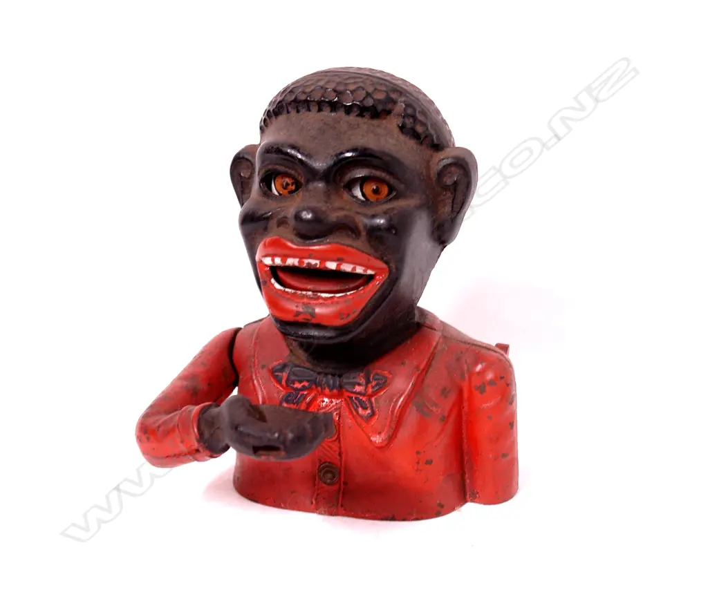 A vintage cast iron Greedy Boy money box Image 1++
