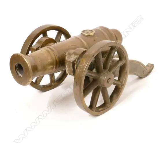 A bronze replica miniature cannon