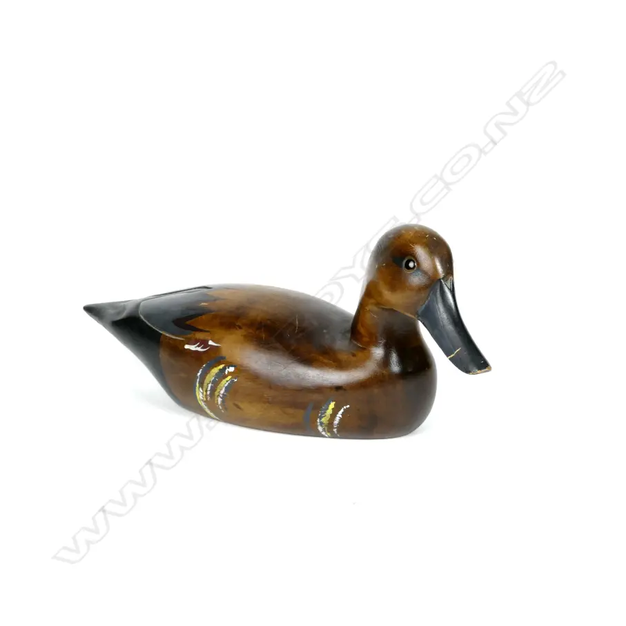 A carved and painted wood duck decoy Image 1++