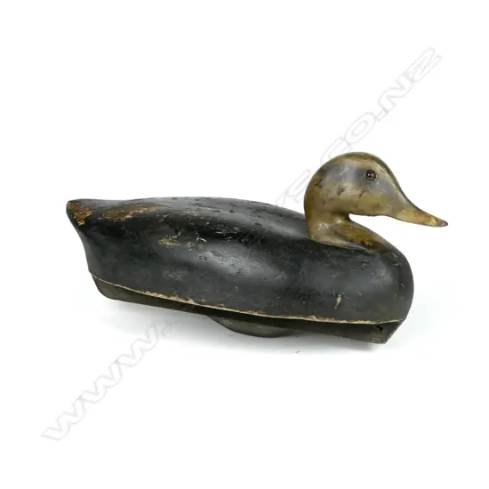 A balsa wood carved duck eyes