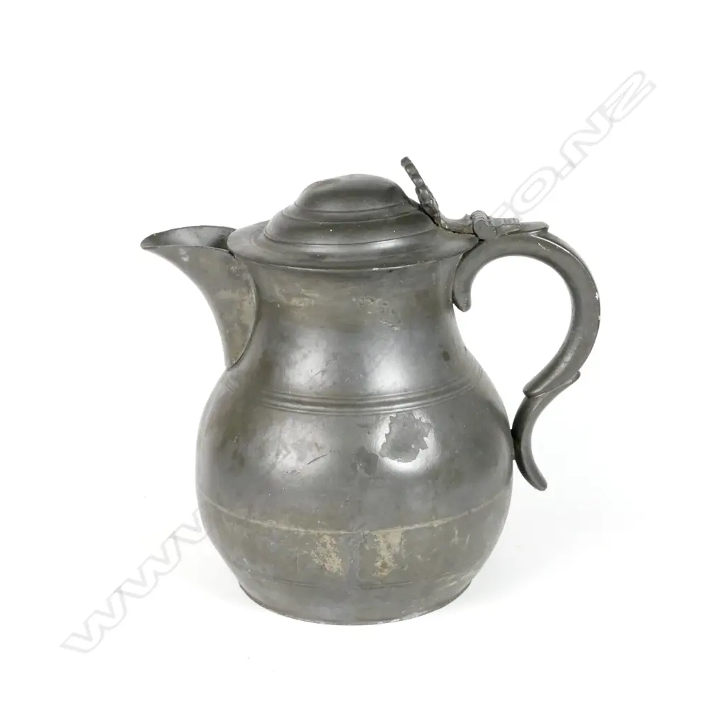 A large pewter lidded flagon with anthemion thumbpiece Image 1++