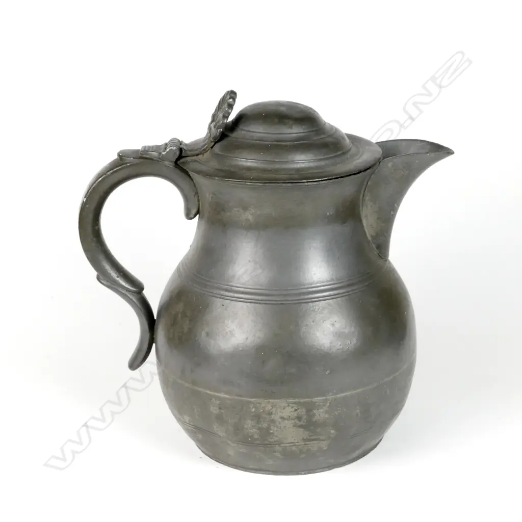 A large pewter lidded flagon with anthemion thumbpiece Image 1++