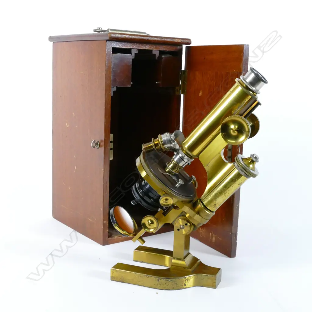 A Bausch & Lomb Optical Co. brass microscope in mahogany case Image 1++