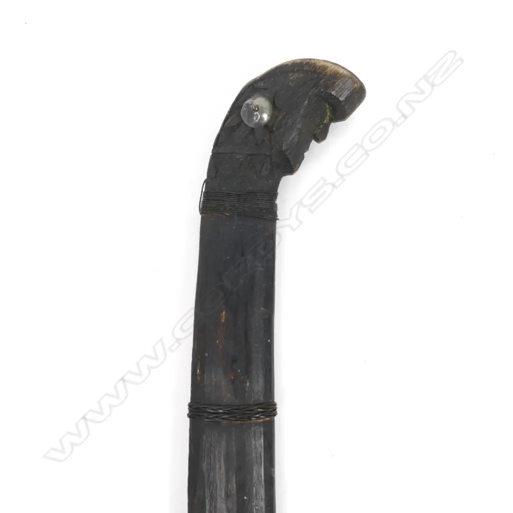 An antique Indonesian knife with a carved animal head handle and original scabbard Image 1++