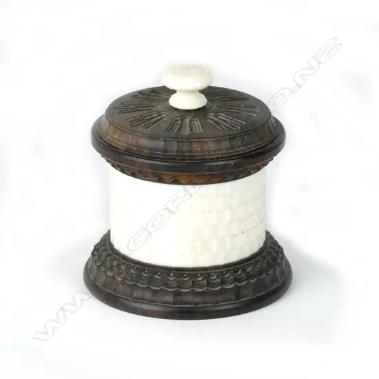 A small circular basket work ivory box with wood lid and base