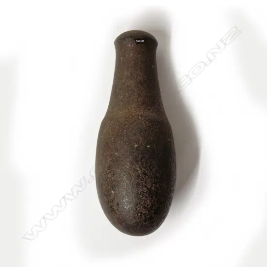 A pre-European Maori patu muka (stone pounder)