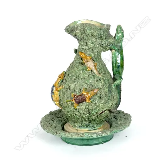 A Victorian 'Palissy Ware' jug in stand