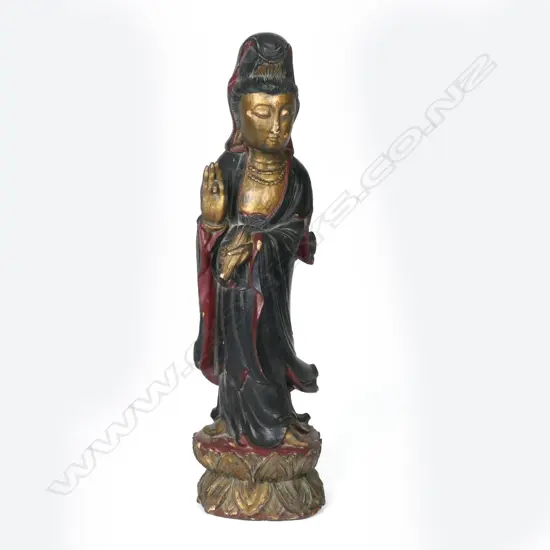 An old Chinese lacquered carved wood figure of Kuanyin