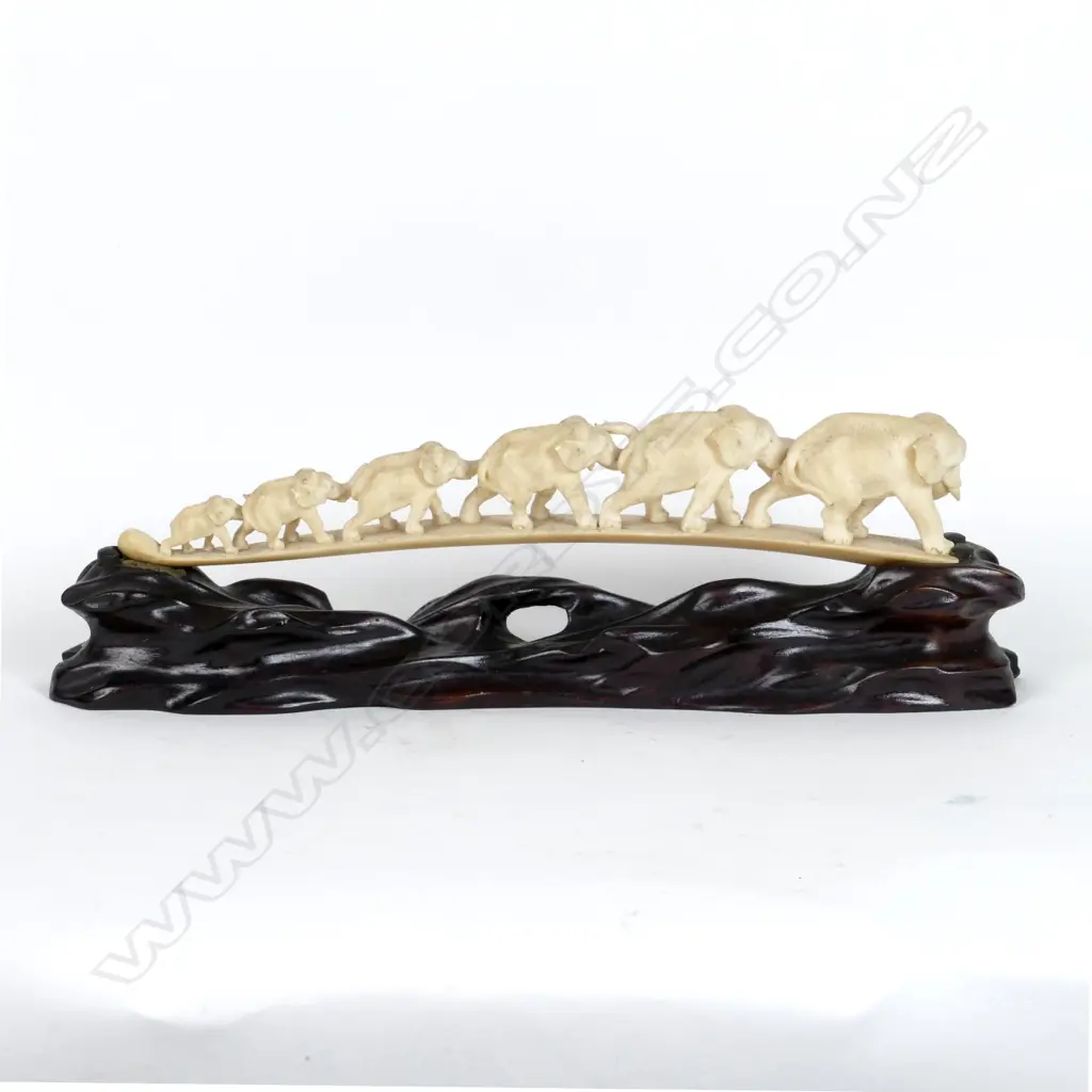 A carved ivory tusk bridge Image 1++