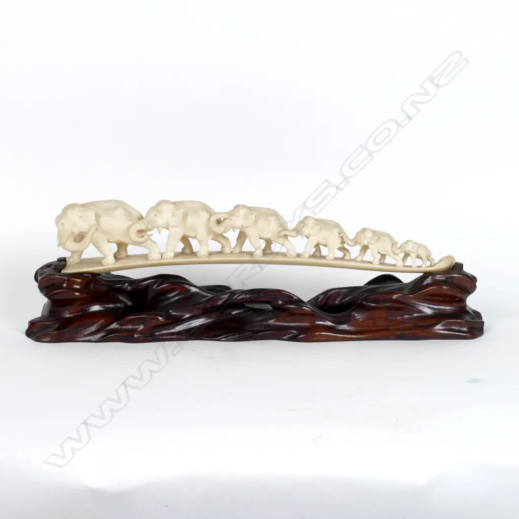 A carved ivory tusk bridge Image 1++