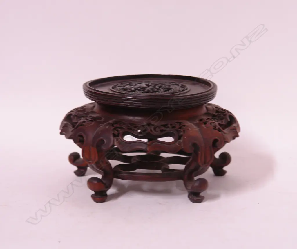 A finely carved hardwood vase stand Image 1++