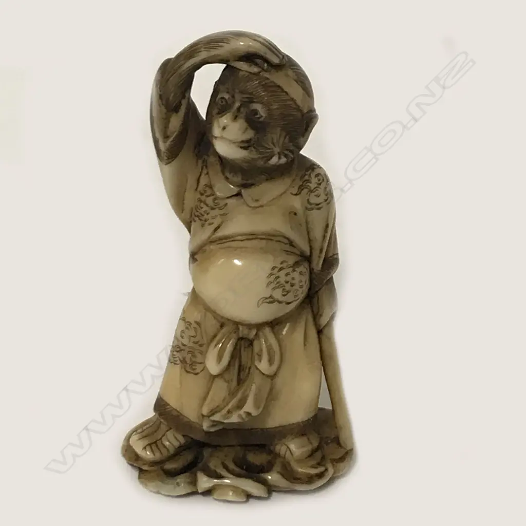 An ivory netsuke of Tanuki Image 1++