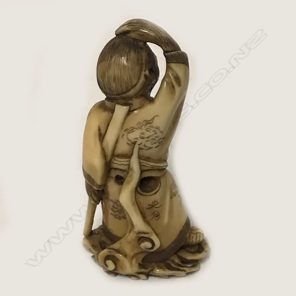 An ivory netsuke of Tanuki Image 1++
