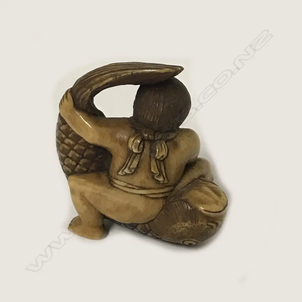 A small ivory okimono Image 1++