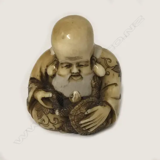 A small and compactly carved ivory netsuke