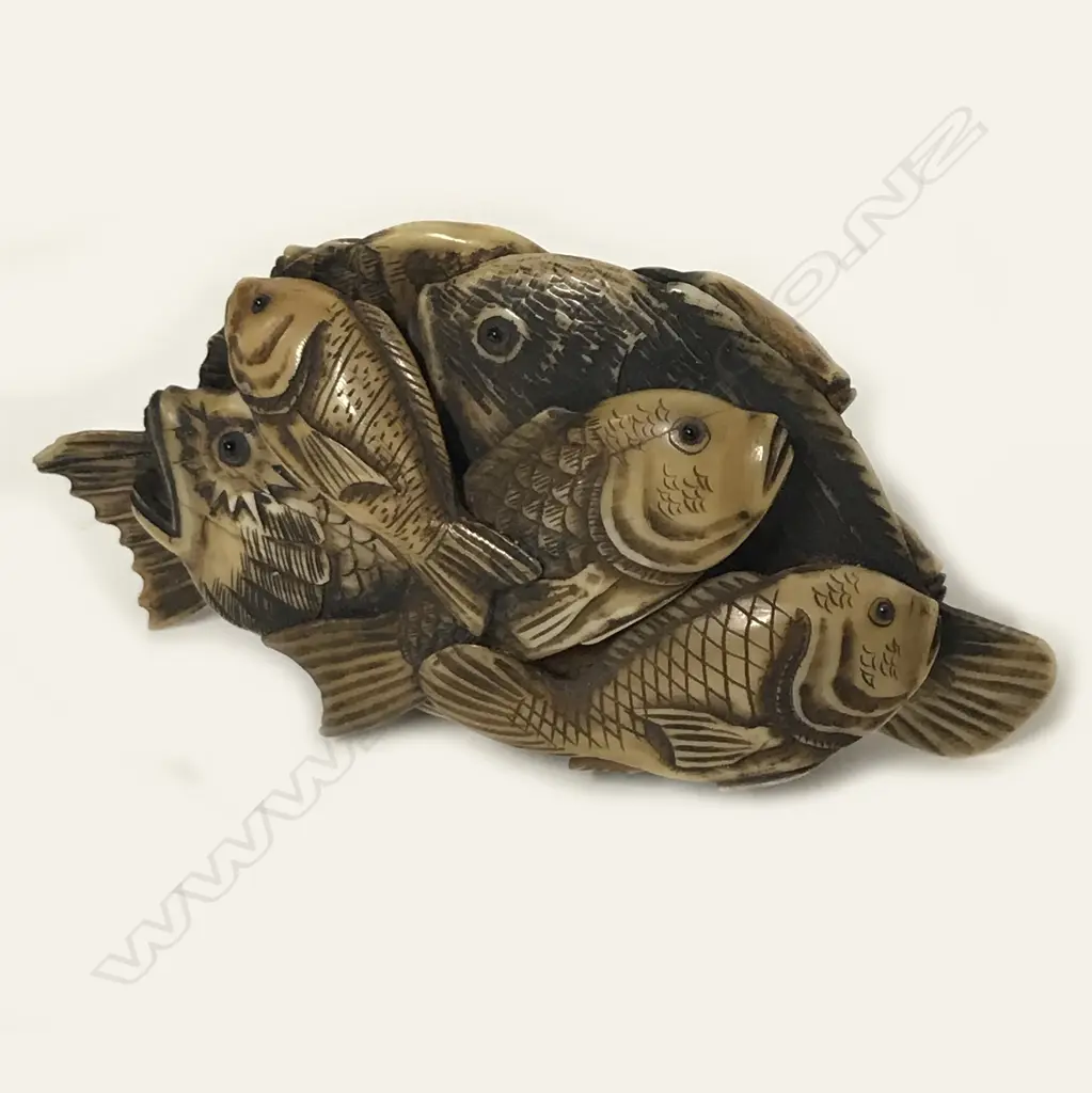 An old compactly carved ivory okimono Image 1++