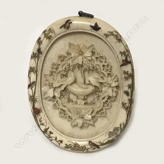 A Japanese Meiji period shibiyama ivory miniature oval frame